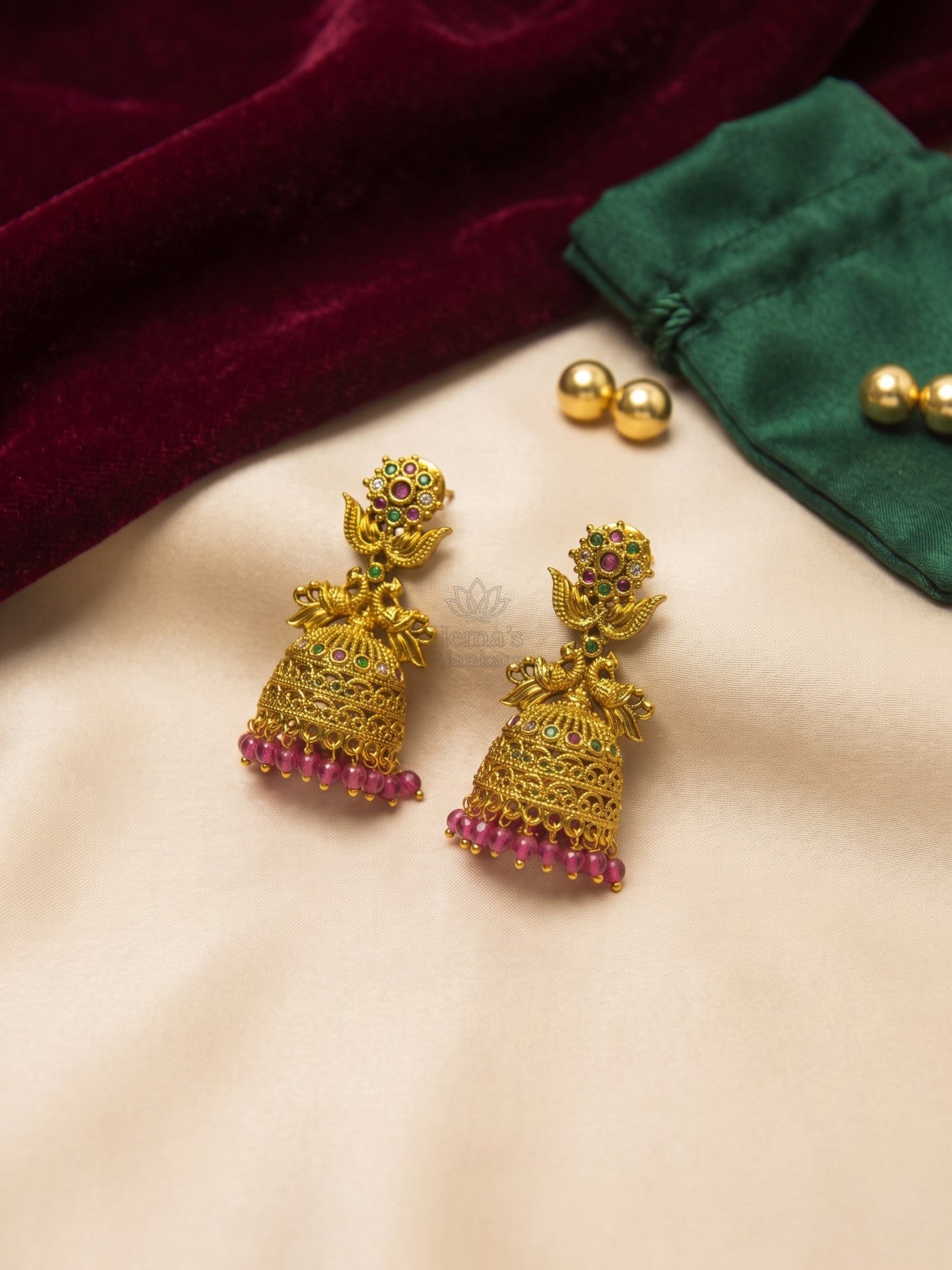 Antique Gold Peacock Jhumka Earrings with Ruby Green Stones & Pink Beads